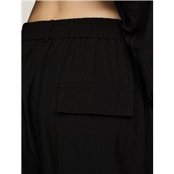 Черные брюки с вырезом ниже колена