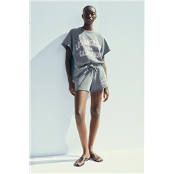 WASHED-EFFECT TEXT PLUSH SWEATSHIRT
