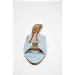 TEXTURED BUCKLE HEELED MULES