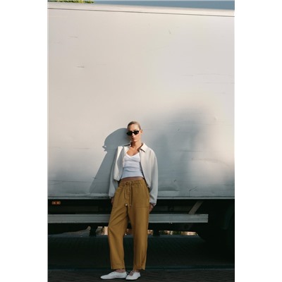 JOGGER TROUSERS WITH BUTTONED HEMS