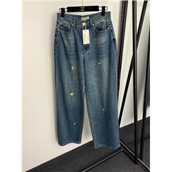 Женские стильные джинсы украшенные золотыми пуговицами особой формы  Schiaparell*i