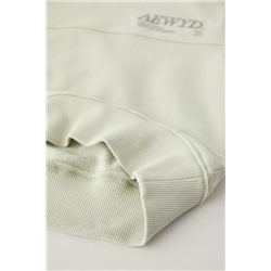 SUDADERA TEXTO BORDADO ETIQUETA