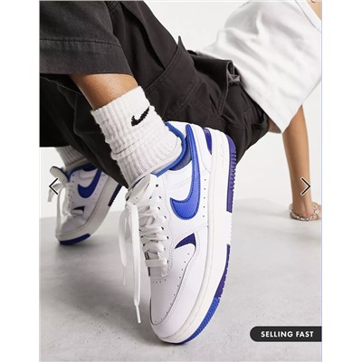 Nike Gamma Force sneakers in white & blue