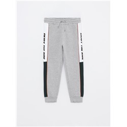 TRACKSUIT BOTTOMS WITH SIDE TAPING