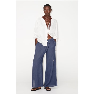 WIDE-LEG WRAP TROUSERS WITH SIDE OPENINGS